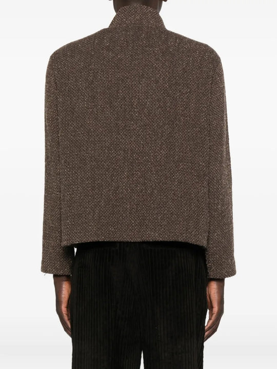 Brown coat worn by a person, showing the coat's fit