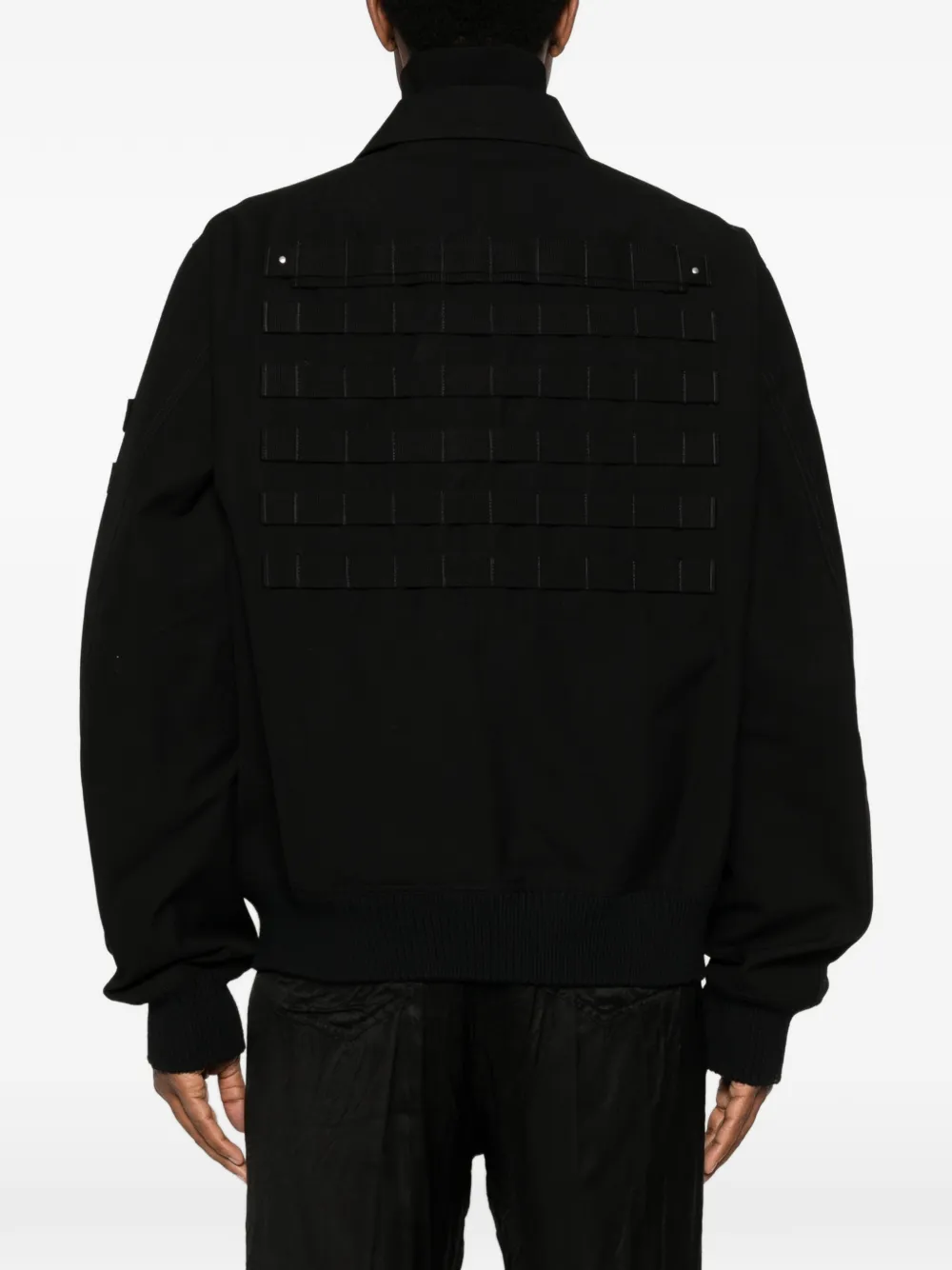 Black jacket worn by a person, showing the jacket's fit