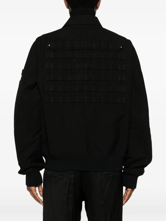 Black jacket worn by a person, showing the jacket's fit