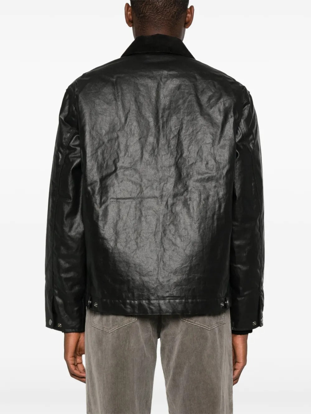 Black jackets worn by a person, showing the jackets fit