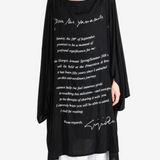 Black dress worn by a person, showing the dress fit
