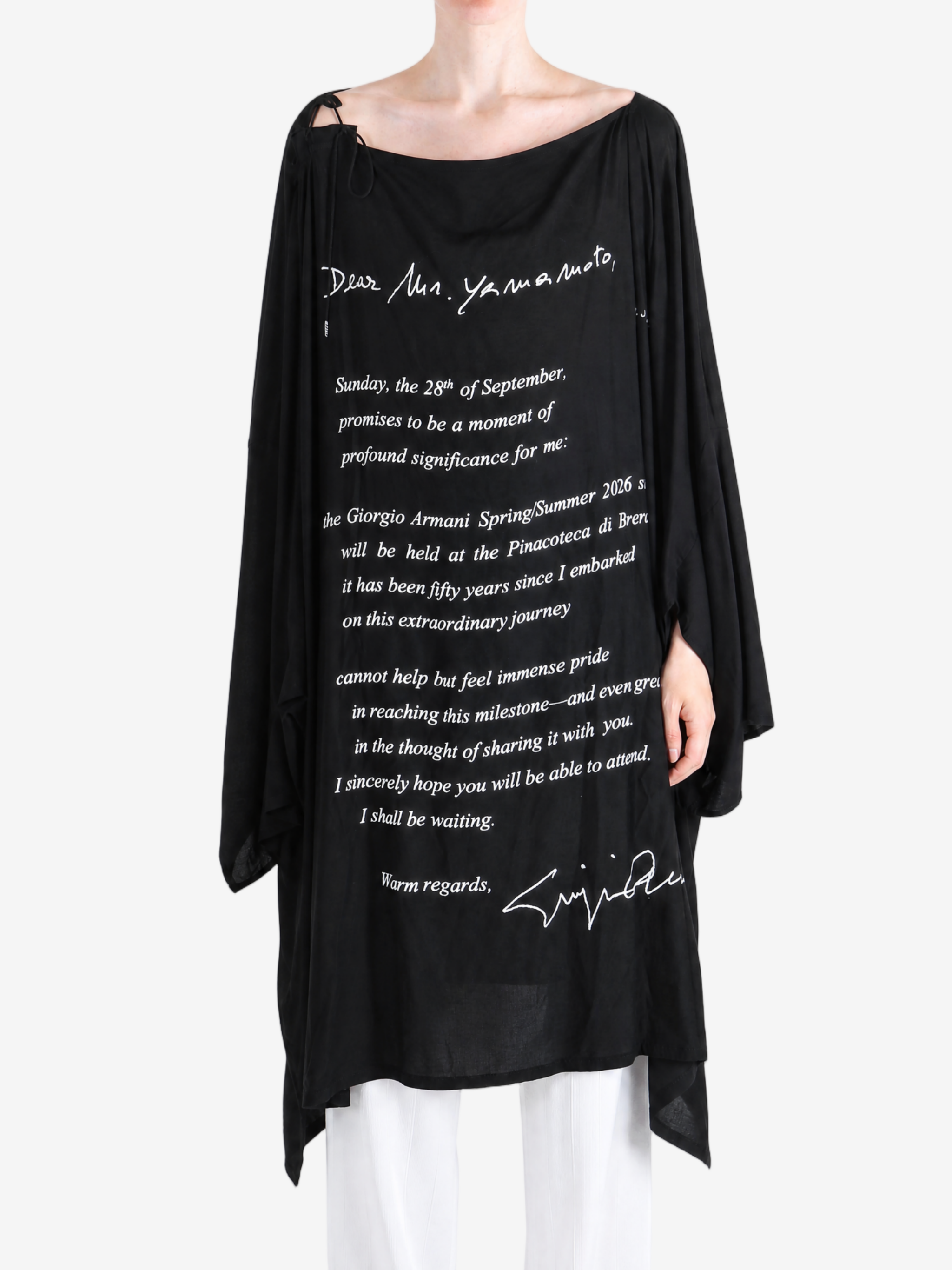 Black dress worn by a person, showing the dress fit