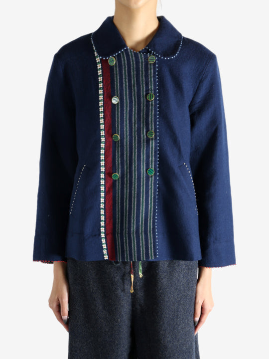 Navy jacket worn by a person, showing the jacket fit