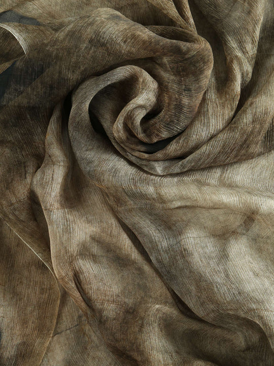 Close up of brown scarf, showing texture of the Silk fabric