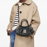 Black bag worn by a person, showing the bag's fit