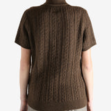 Brown knitwear worn by a person, showing the knitwear fit