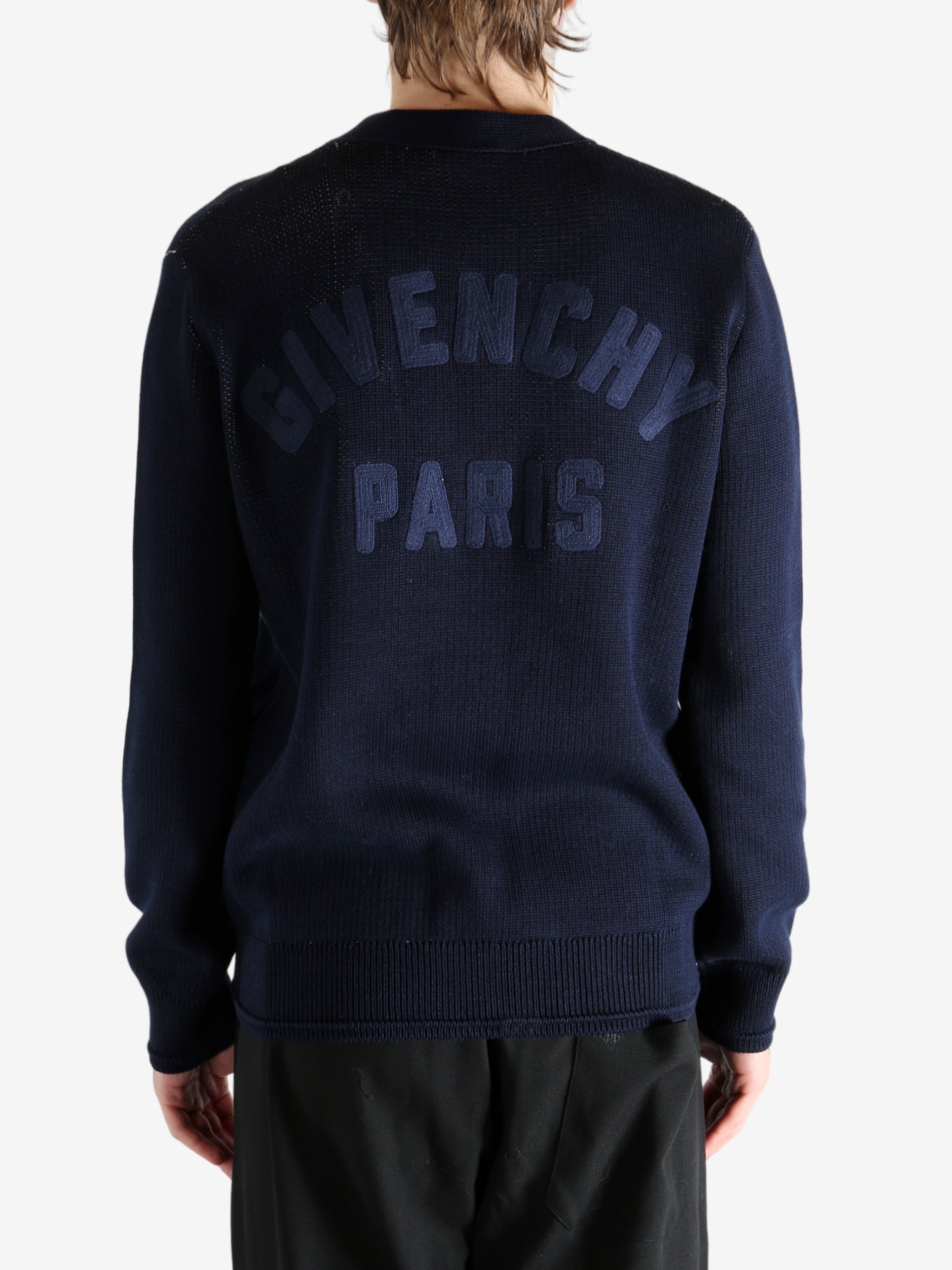 Navy cardigan worn by a person, showing the cardigan's fit