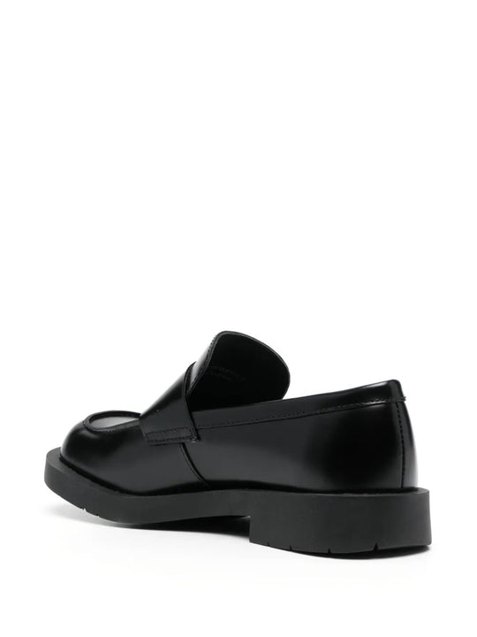 Black loafers, back view