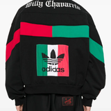 Black knitwears worn by a person, showing the knitwears fit