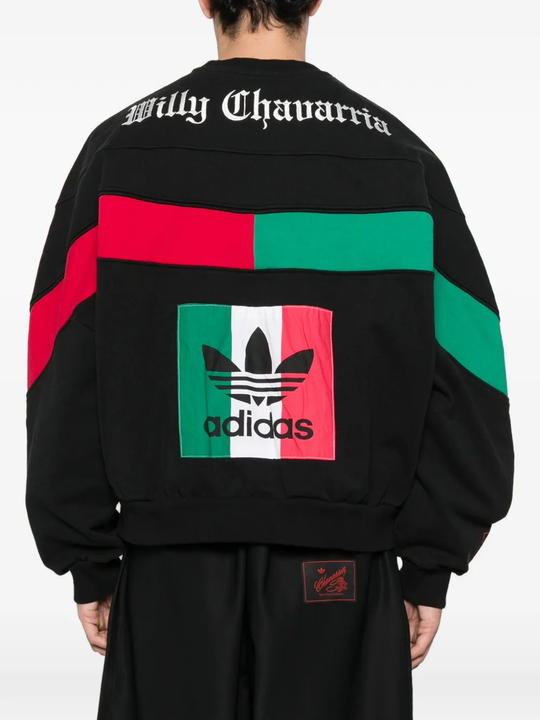 Black knitwears worn by a person, showing the knitwears fit