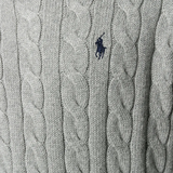 Close up of grey sweater,showing texture of the cotton fabric.