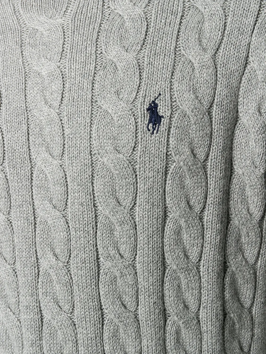 Close up of grey sweater,showing texture of the cotton fabric.