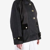Black jacket worn by a person, showing the jacket fit