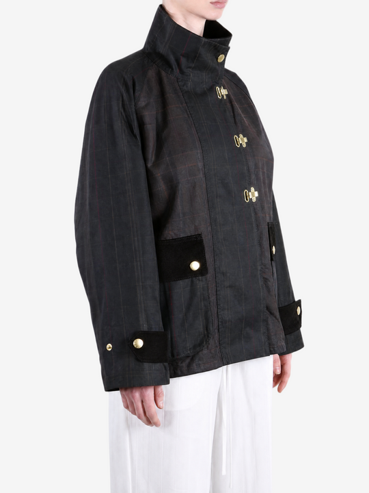 Black jacket worn by a person, showing the jacket fit