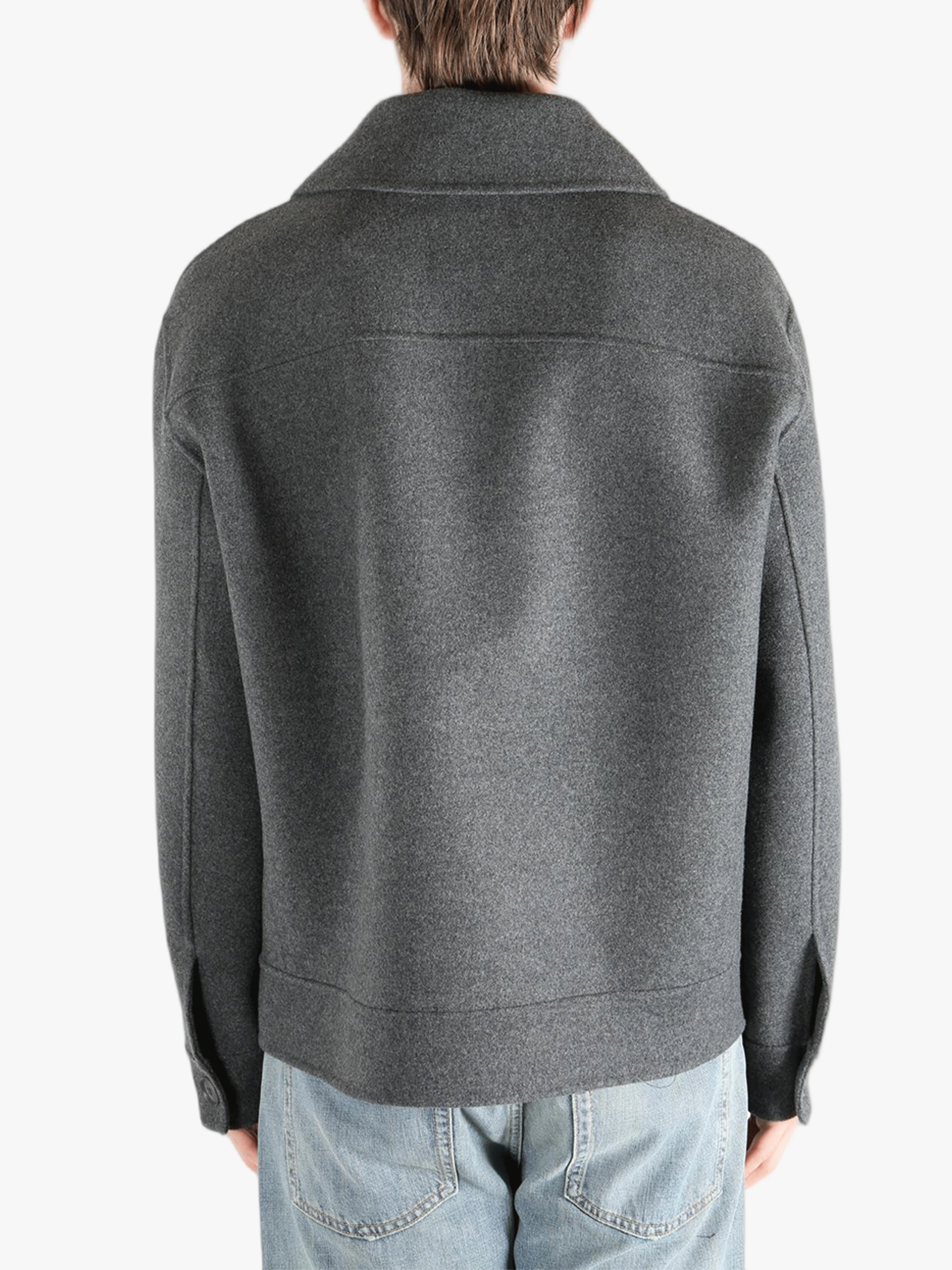 Grey jacket worn by a person, showing the pants fit