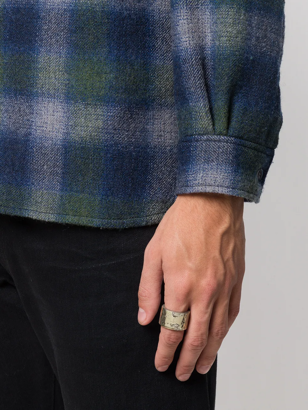 Yellow jewelry worn by a person, showing the jewelry fit