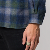 Yellow jewelry worn by a person, showing the jewelry fit