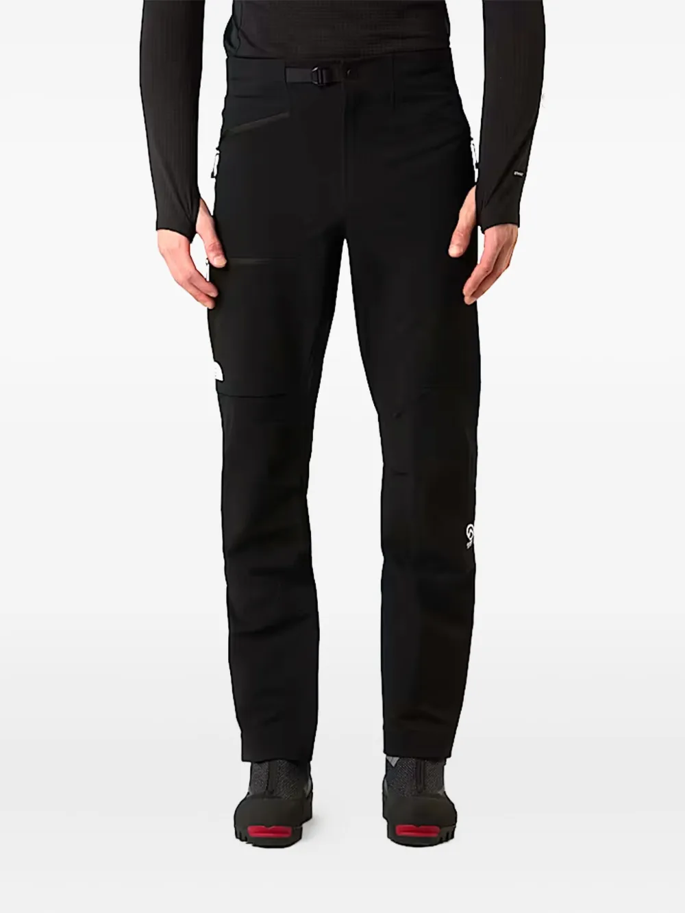 Black pant worn by a person, showing the pant fit