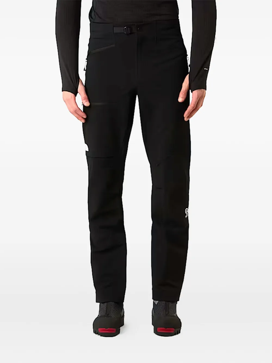 Black pant worn by a person, showing the pant fit