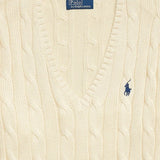 Close up of tan pullover, showing texture of the cotton fabric