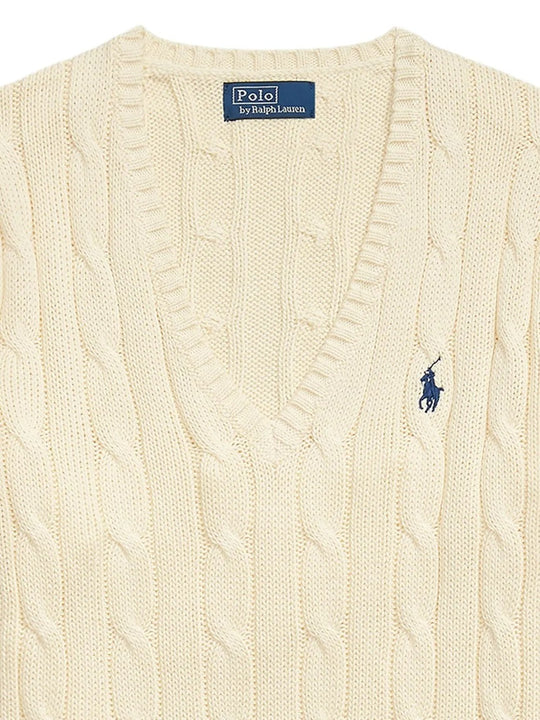 Close up of tan pullover, showing texture of the cotton fabric