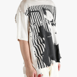 White t-shirt worn by a person, showing the t-shirt's fit