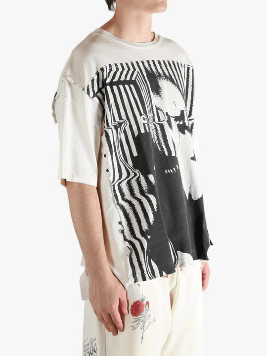 White t-shirt worn by a person, showing the t-shirt's fit