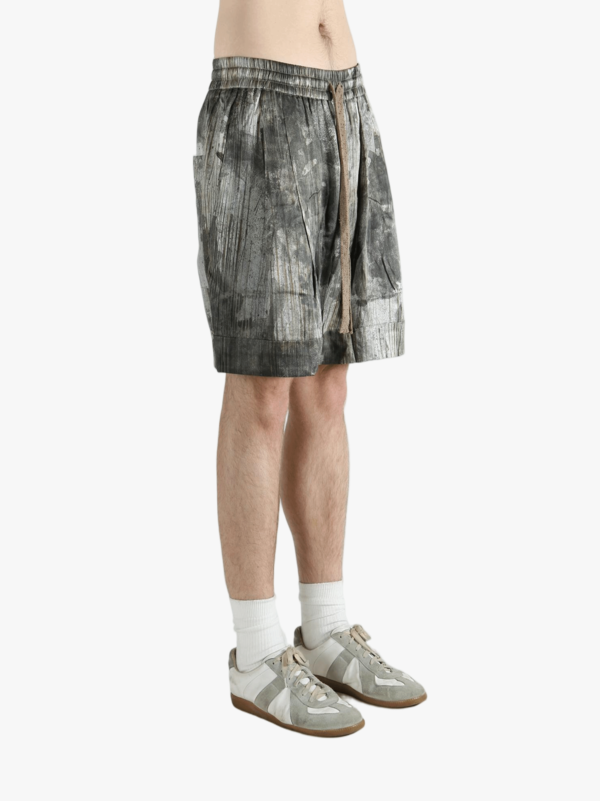 Green shorts worn by a person, showing the shorts's fit