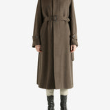 Brown coat worn by a person, showing the coat fit