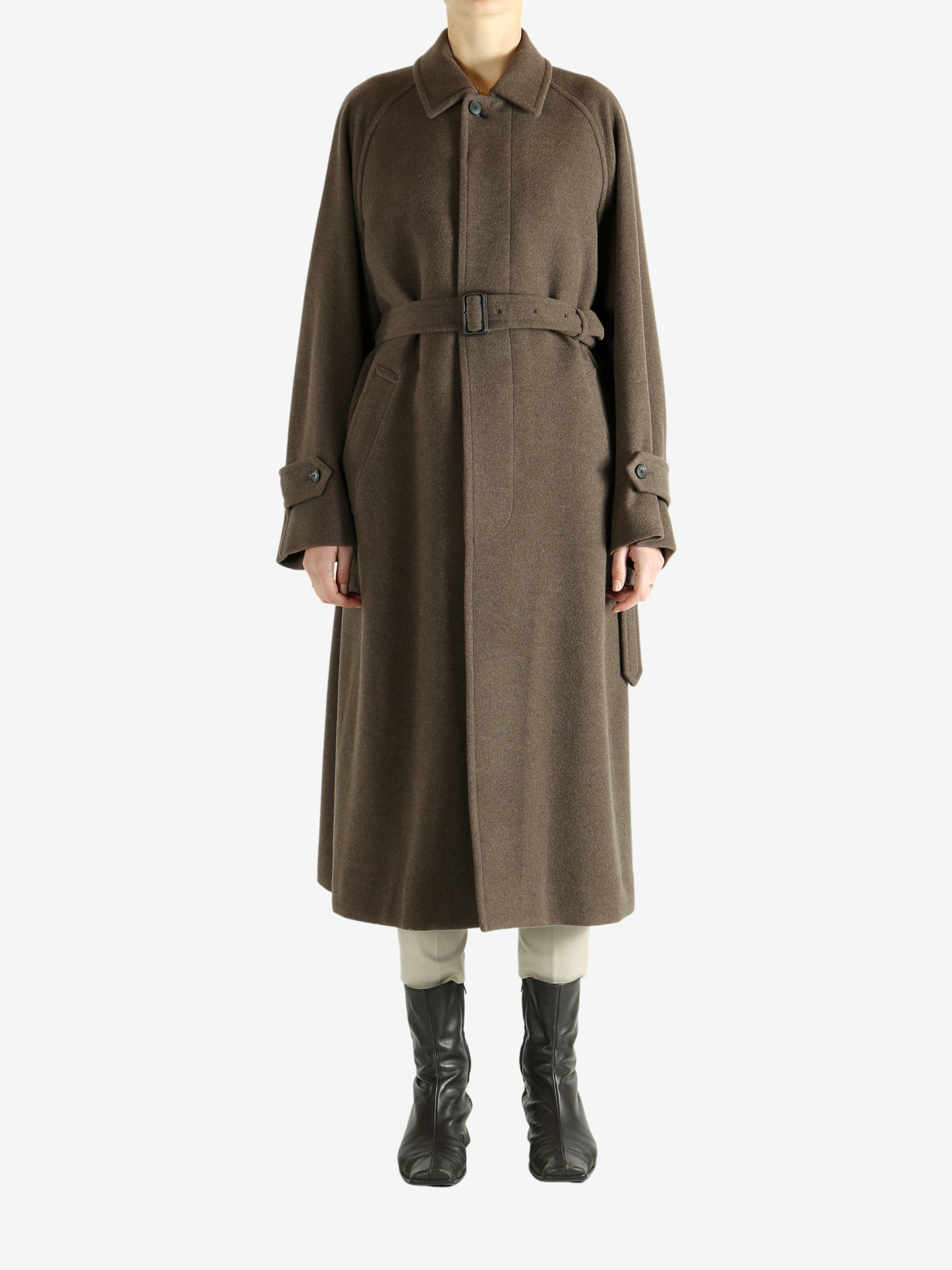 Brown coat worn by a person, showing the coat fit