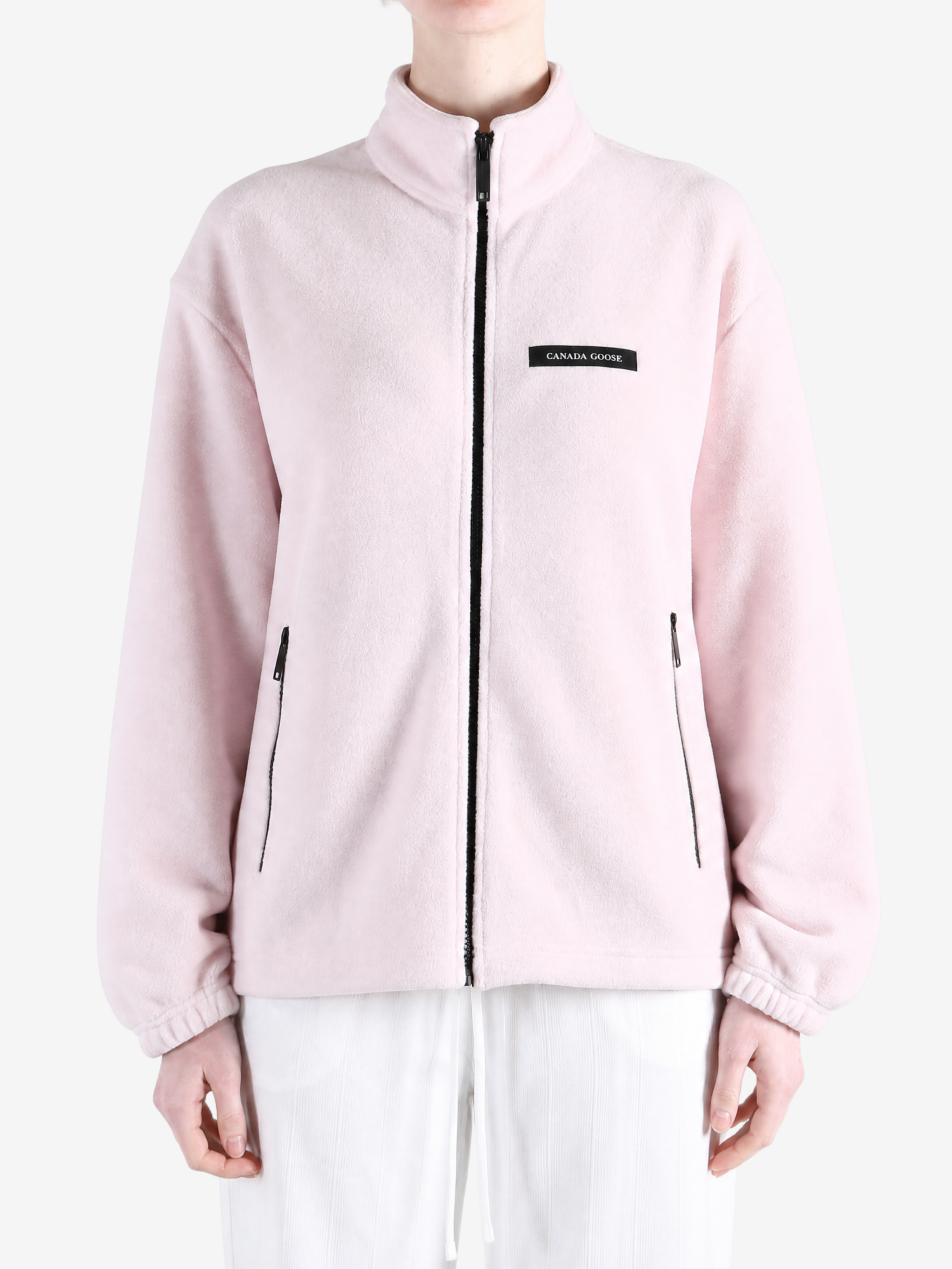 Pink jacket worn by a person, showing the jacket fit