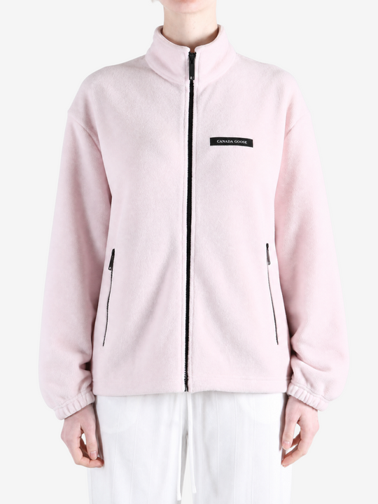 Pink jacket worn by a person, showing the jacket fit