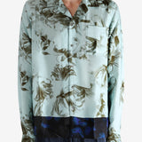 Green shirt worn by a person, showing the shirt's fit