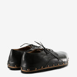 Black derby, back view