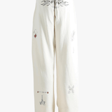 White pants worn by a person, showing the pants fit