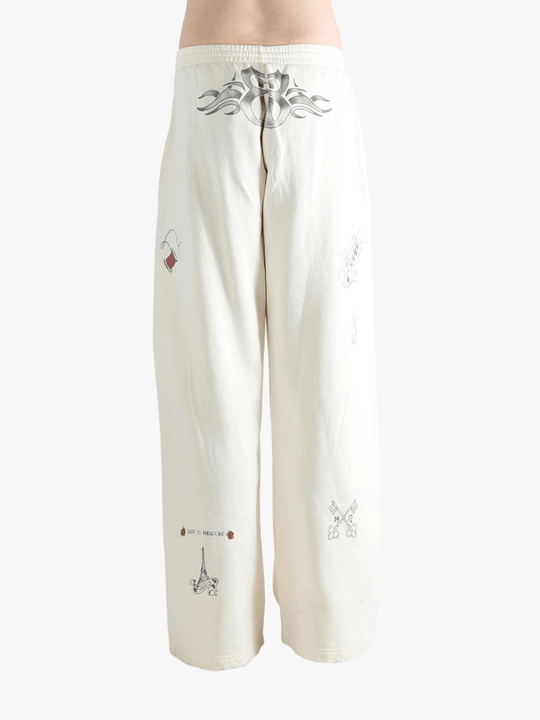White pants worn by a person, showing the pants fit