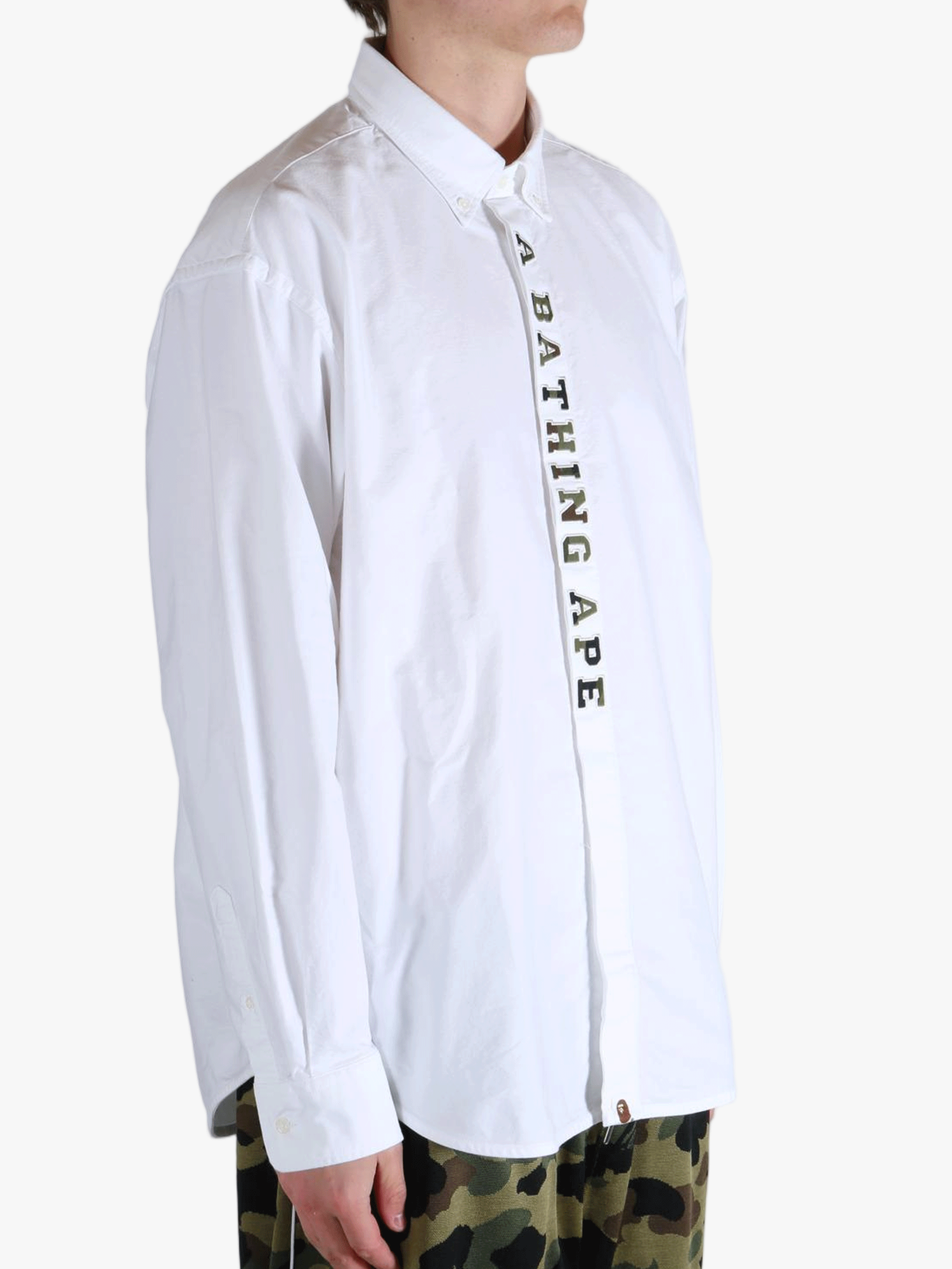 White shirt worn by a person, showing the shirt's fit