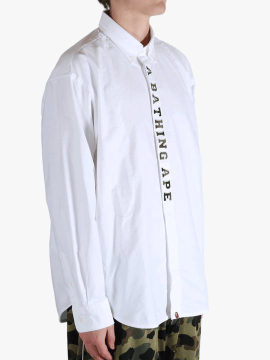 White shirt worn by a person, showing the shirt's fit
