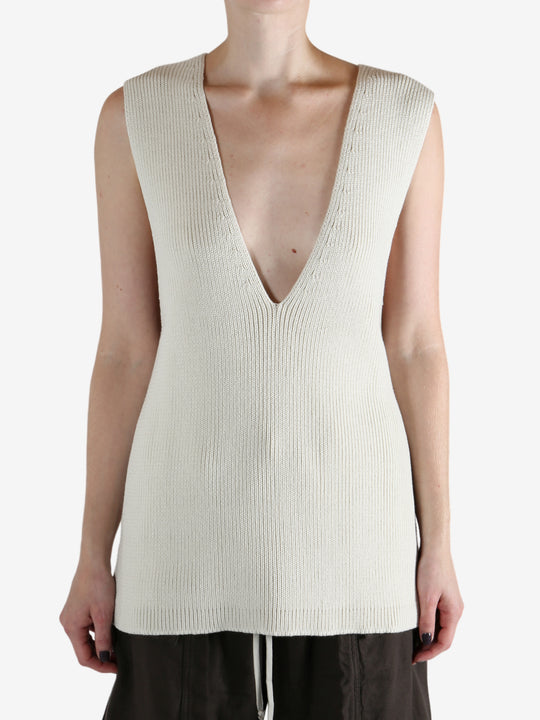 White top worn by a person, showing the top's fit