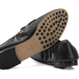 Black loafer, side view