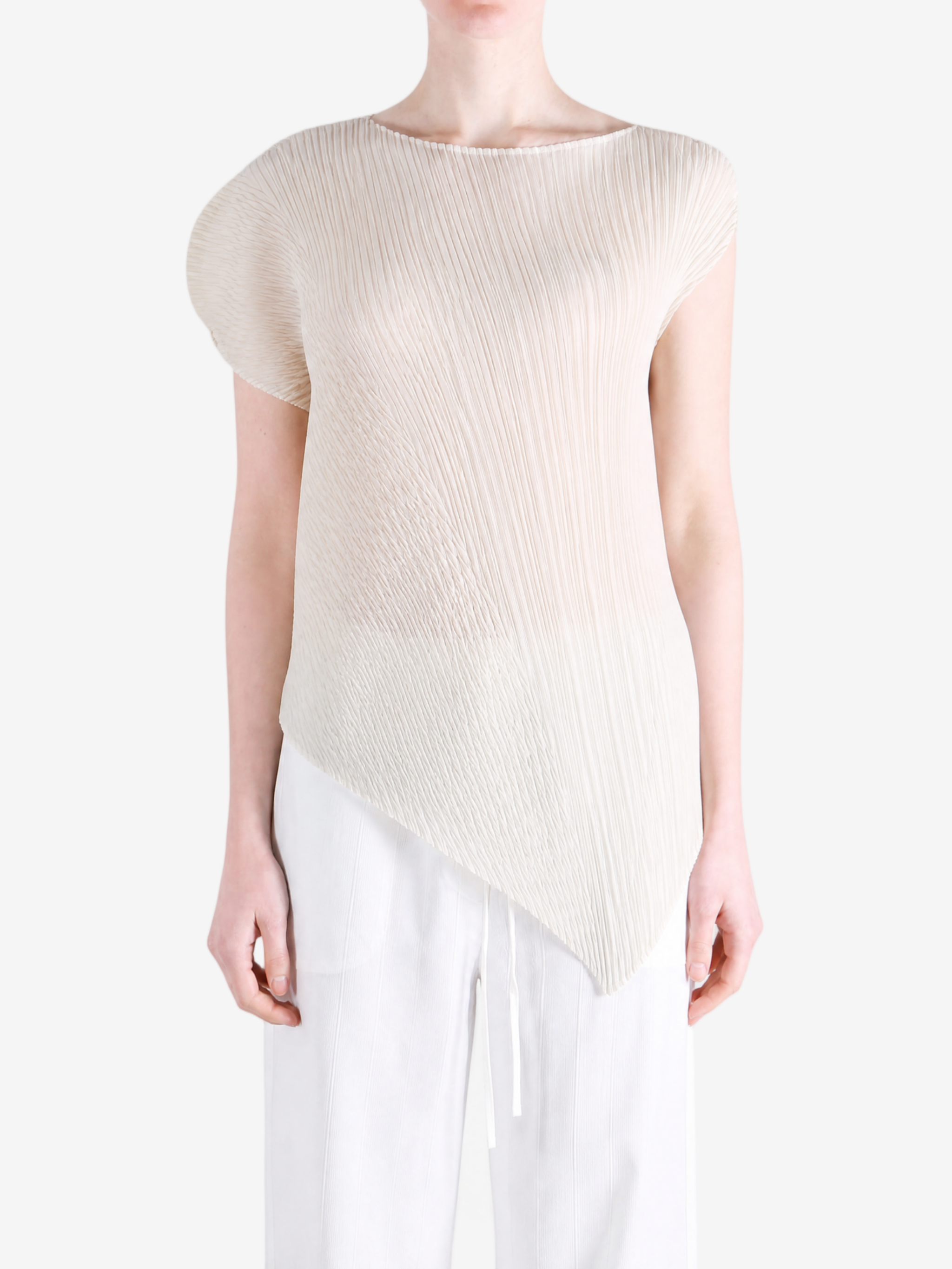 Tan shirt worn by a person, showing the shirt fit