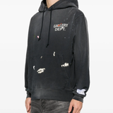 Black hoodie worn by a person, showing the hoodie fit