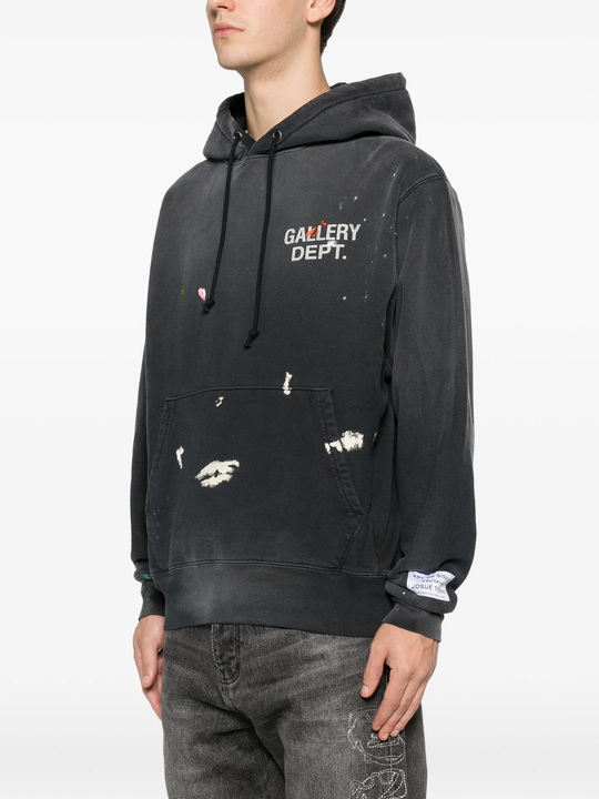Black hoodie worn by a person, showing the hoodie fit