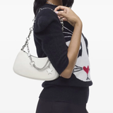 White bag worn by a person, showing the bag's fit