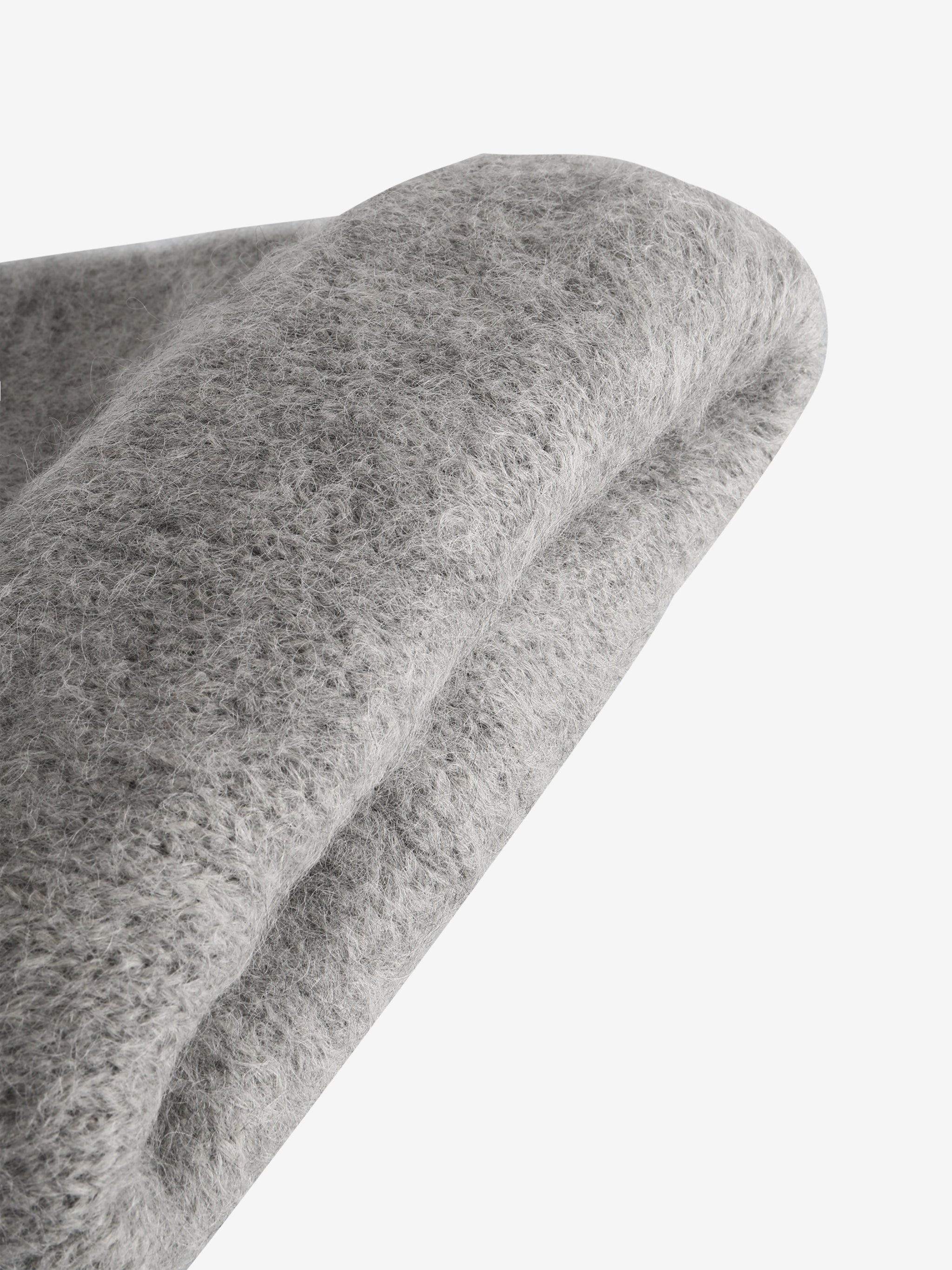 Close up of grey hats, showing texture of the fabric