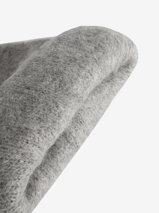 Close up of grey hats, showing texture of the fabric