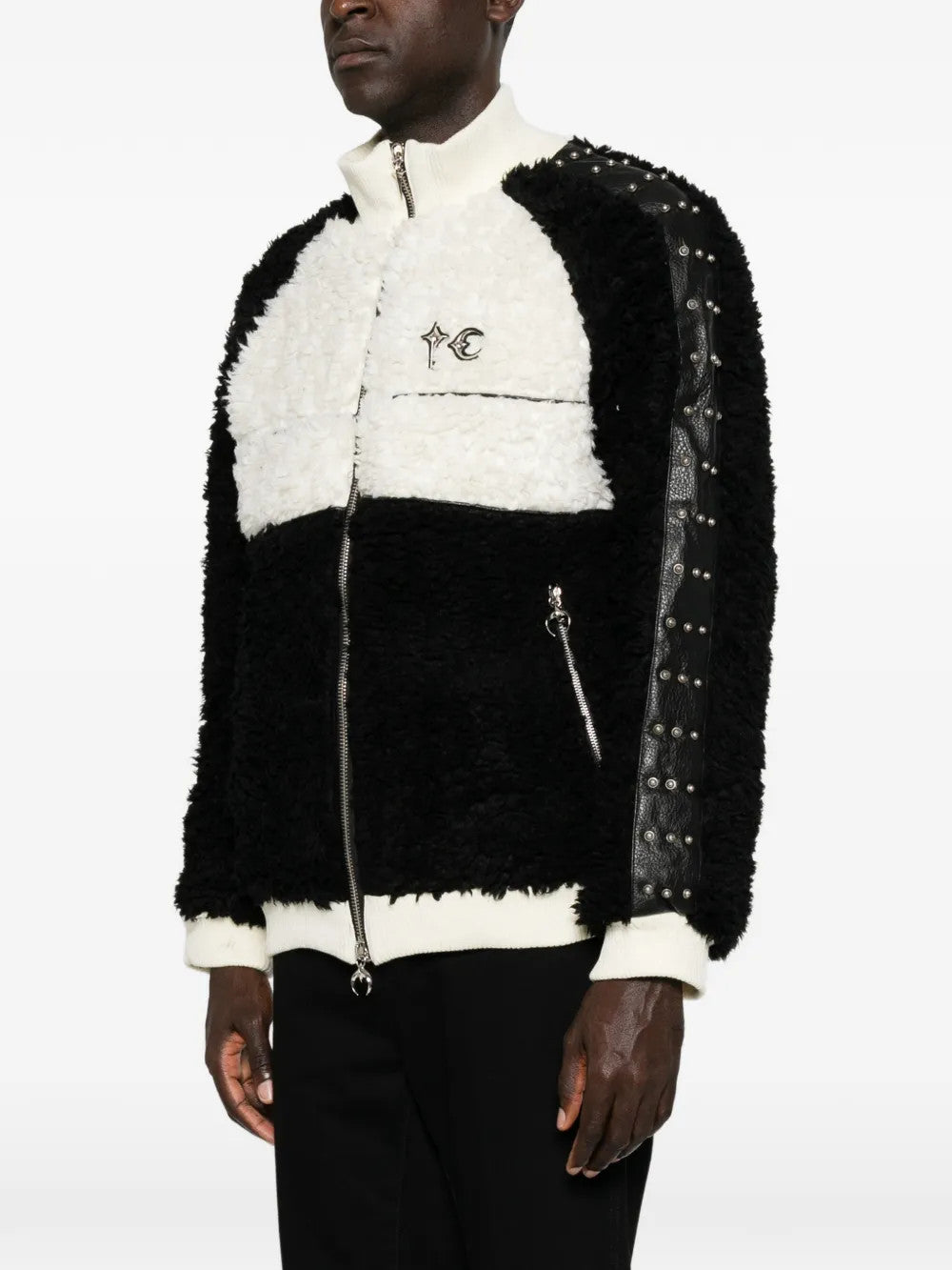 Black jacket worn by a person, showing the jacket fit