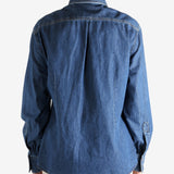 Blue jacket worn by a person, showing the jacket fit
