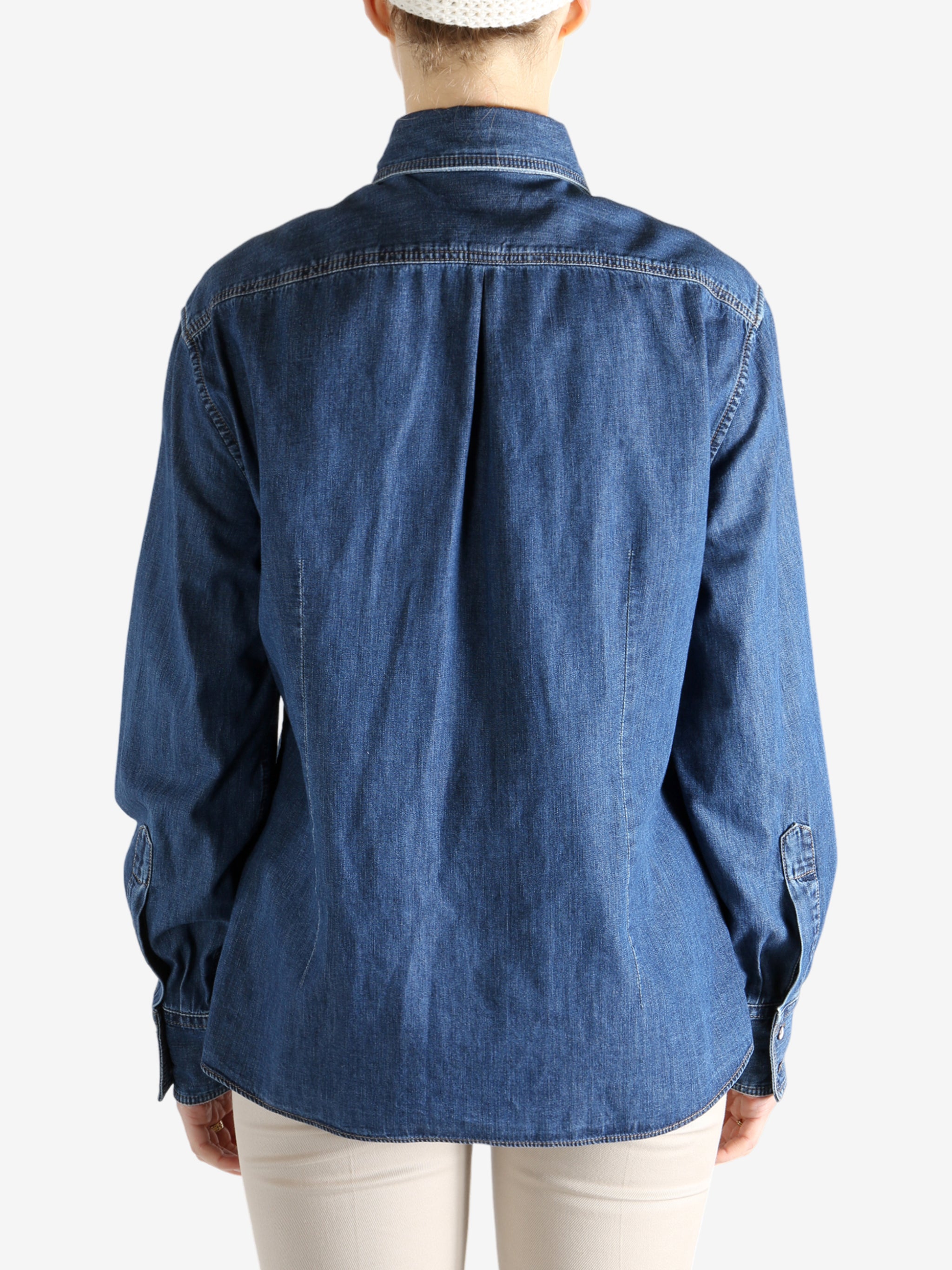 Blue jacket worn by a person, showing the jacket fit