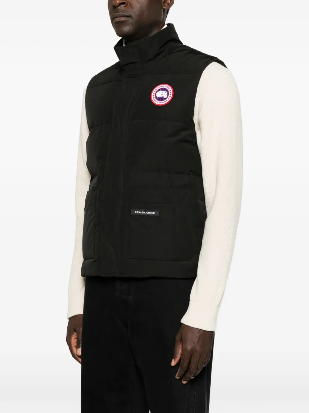 Black jacket worn by a person, showing the jacket fit